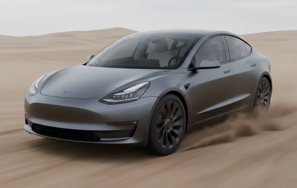 Grey Tesla Model 3 in a flat matte wrap on a desert road