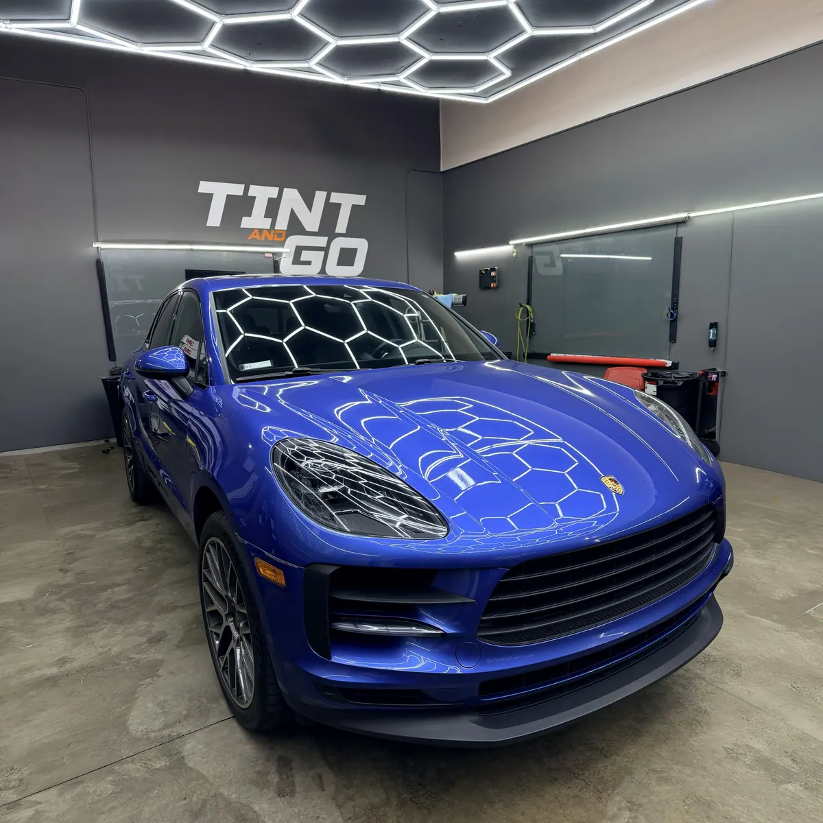 Blue Porsche Macan with a glossy protected finish inside Tint and Go Pro